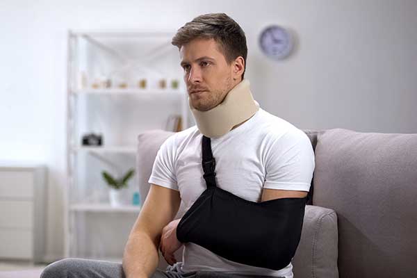 Picture Of A Person Bandaged Neck And Left Hand Fracture